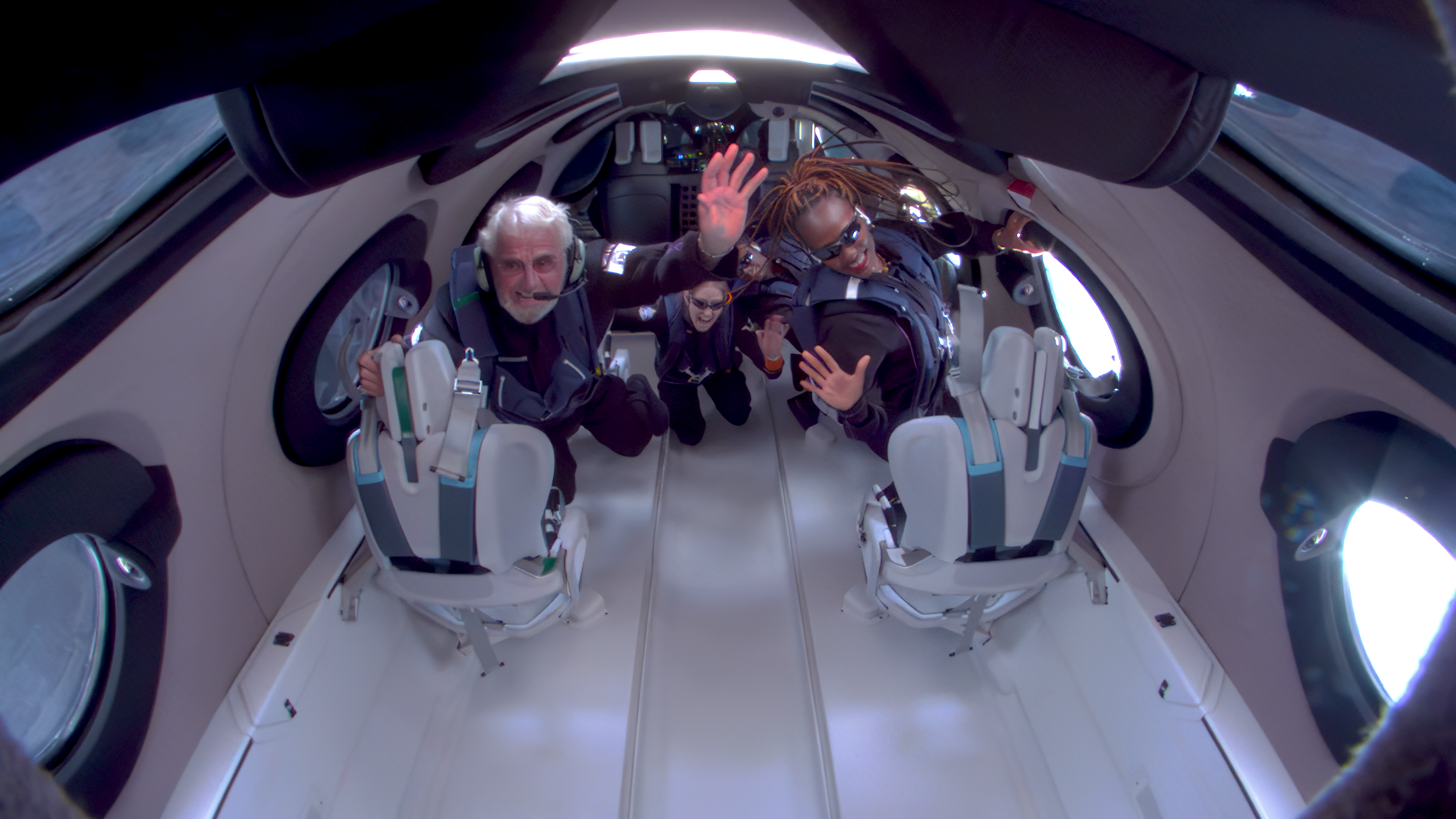 Passengers of Galactic 2 in the cabin of VSS Unity